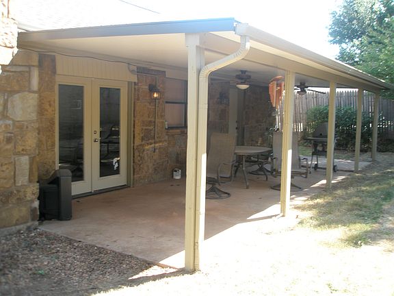Updated back patio with ceiling fans