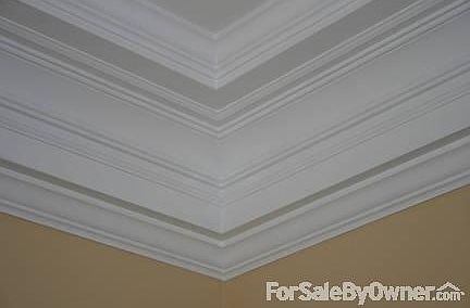 Living room crown molding
						:
						11' living room ceiling with massive crown molding.