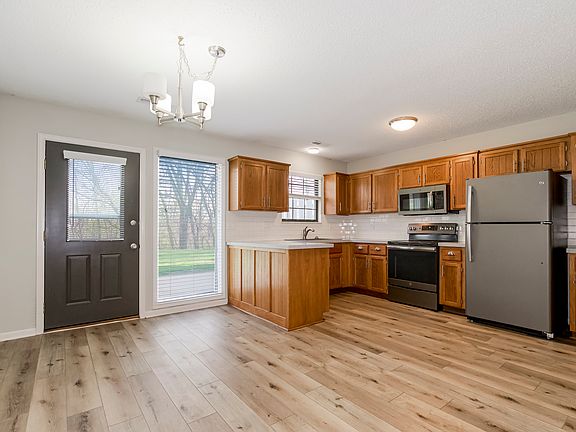 Open Floorplan with adjoining dining and kitchen with peninsula.