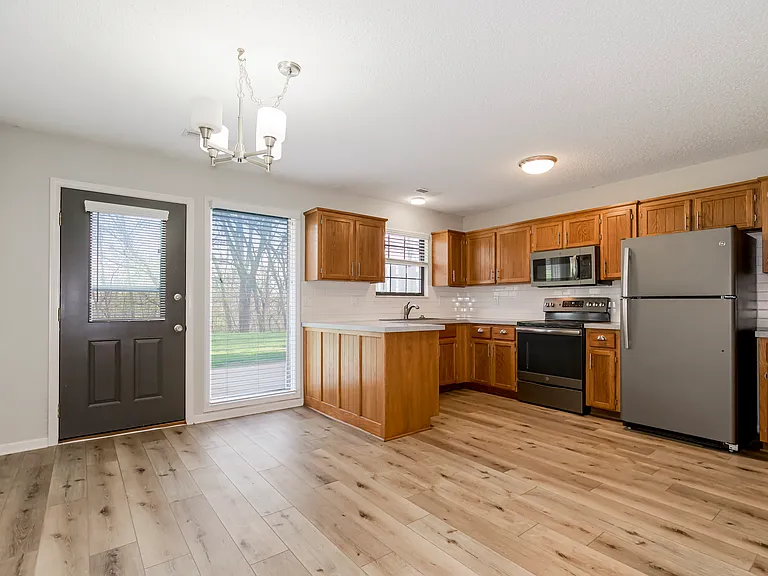 Open Floorplan with adjoining dining and kitchen with peninsula.
