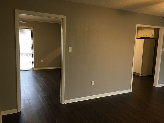 Dining room looking into den and kitchen