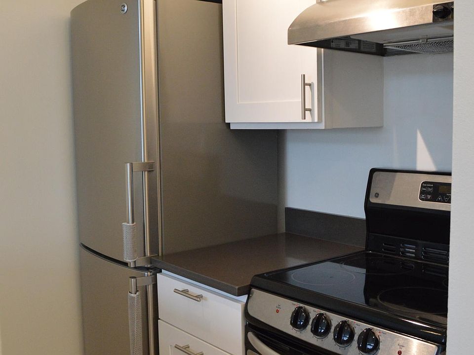 Kitchen area with refrigerator and oven