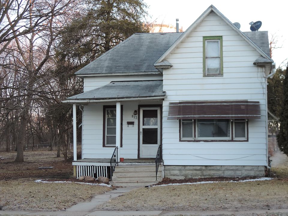 The front porch has been redone since this picture. Most of those trees in the background are gone.