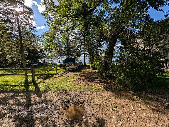 20' of shoreline on fully recreational Forest Lake with private access and a private dock located across the street from the home.