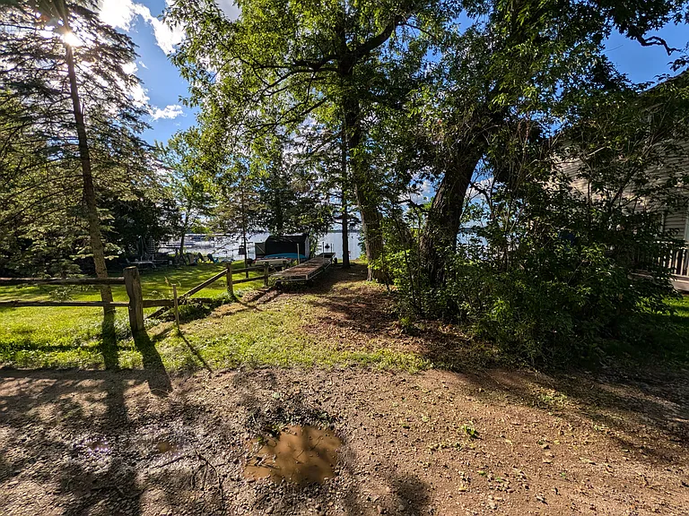 20' of shoreline on fully recreational Forest Lake with private access and a private dock located across the street from the home.