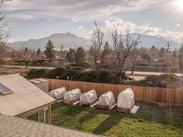 Garden view from the front of the house, highlighting the position of Foothills Parkway behind the back yard.