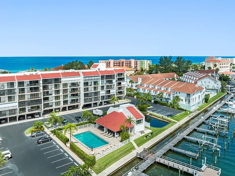 Exterior Shot of Building, Pool and Private Dock Slip