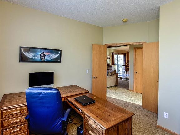 Main level bedroom is currently being used as a home office.