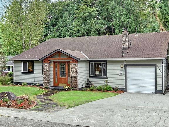 This home features a gabled front porch with stone pillars that add great charm and character to the home.