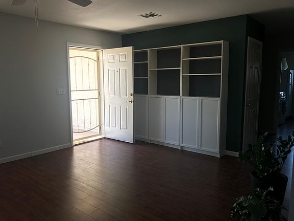View from dining room toward the front door. The bookcases are moveable.