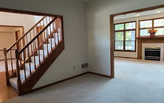 How great is this open area off the foyer! From the living room you have the vantage point of seeing what is going on in the dining room, watch the fire in the fireplace in the recreational room, and check on who is going upstairs or downstairs.
White du