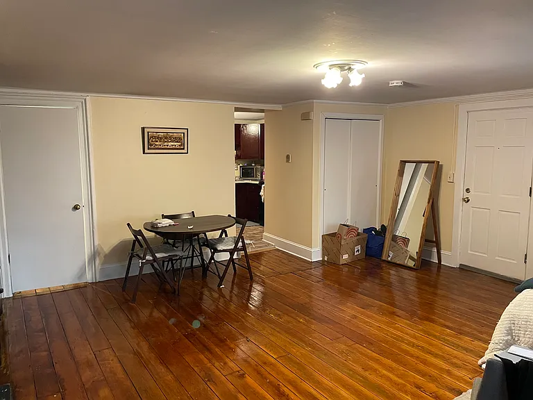 Living room looking at main entrance and kitchen entrance