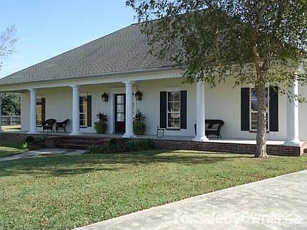 Front Porch is huge.
						:
						Has gas laterns. Also has recessed lights in ceiling of porch. Has recepticles.