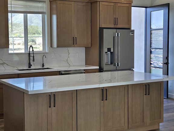 Kitchen with warm wood finishes and a spacious island perfect for family gatherings.