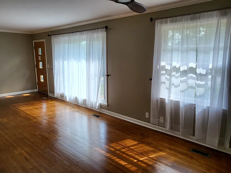 Living room with beautiful floors throughout.