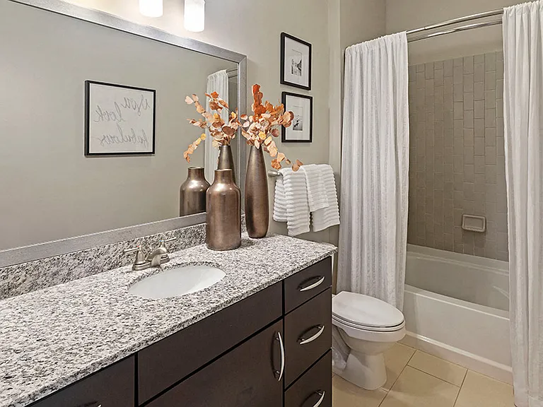 Beautiful bathrooms feature vertical subway tile and relaxing soaking tubs
