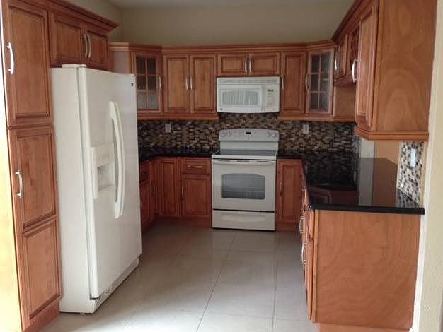Beautiful new kitchen with wood cabinets and granite counter