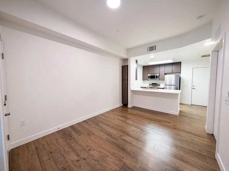 One Bedroom - Living Room with view to kitchen