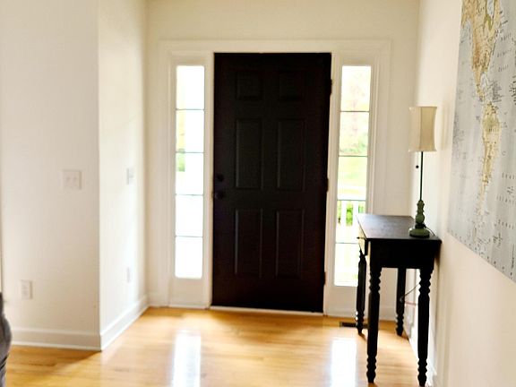 Front door leading to porch