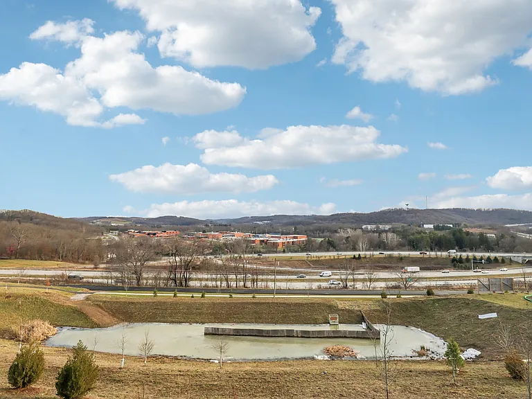 View from walkout basement - pond, community walking trail and Seneca valley school