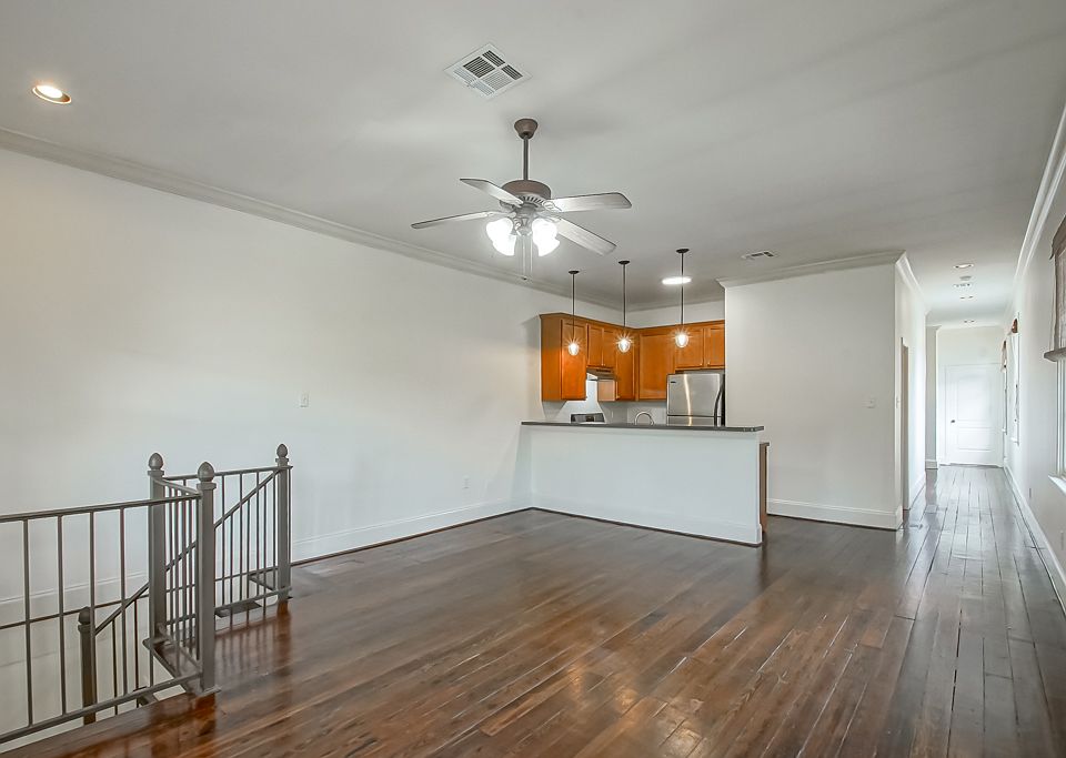 Spacious living with wide pine flooring and high ceilings