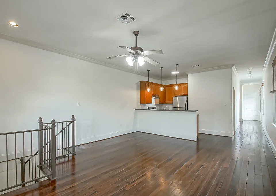 Spacious living with wide pine flooring and high ceilings