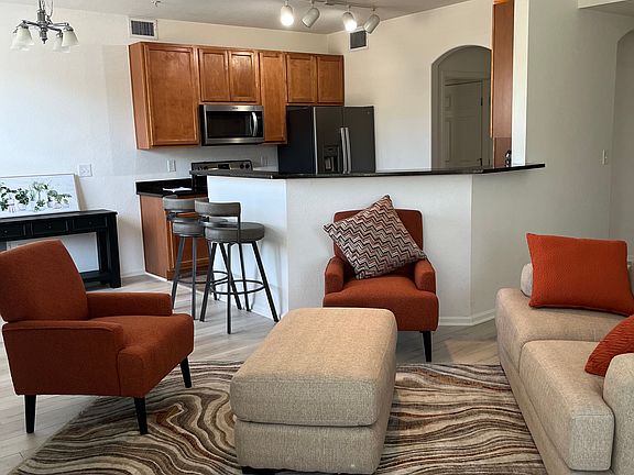 Middle of the room living room furniture configuration. New upgraded vinyl plank flooring.