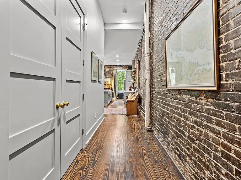 Entryway facing into the apartment with laundry closet on the left.