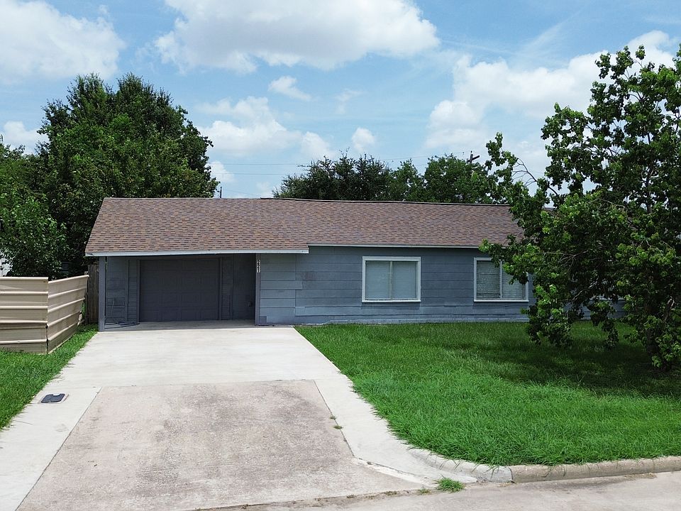 Front exterior view of this 3-bedroom, 2-bathroom Pasadena rental home, featuring a covered entry, attached garage, and a spacious backyard. Explore the included 360_ virtual tour for a complete look inside.