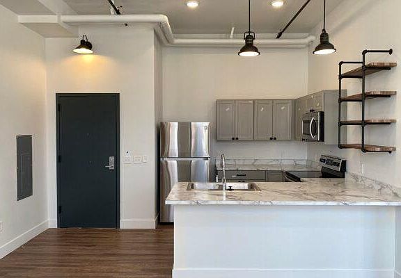 Kitchens with high ceilings and plenty of storage.