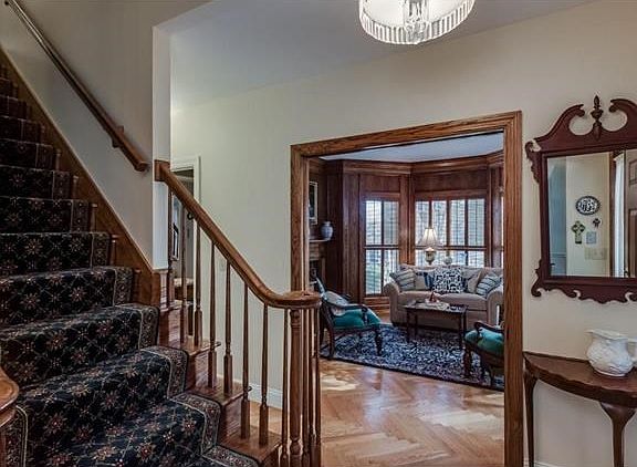 Inviting entry foyer with view of study/office