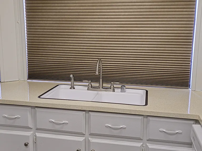 Spacious sink with window looking into backyard