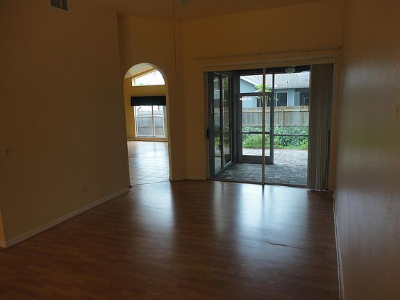 Living Room - Laminate Flooring - 8' Tall Sliding Door to Covered Patio