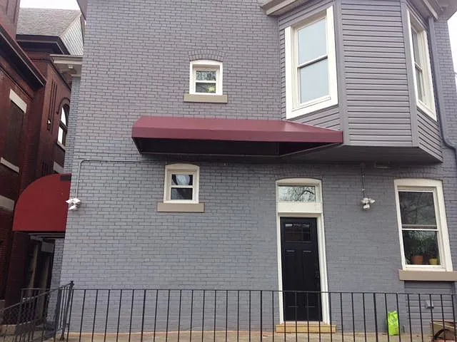 Entrance to back stairs and third floor apt is the covered awning on the left side of this photo.