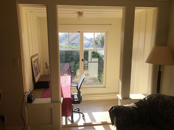 Alcove room being used as office, opening out to garden