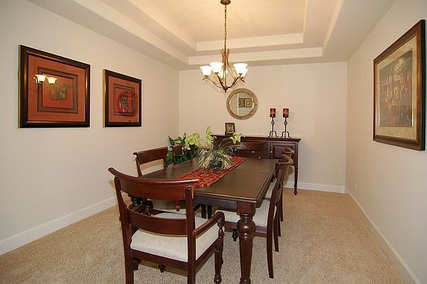 Formal dining room with coffered ceiling
