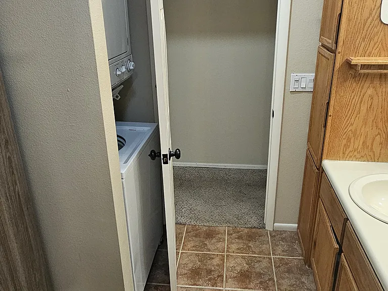 master bathroom, stackable washer dryer in suite