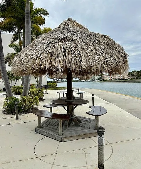 steps from tiki hut area with BBQs- eat and play at the water