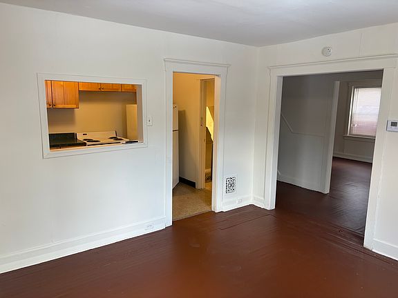 Dining room looking into kitchen and across to living room