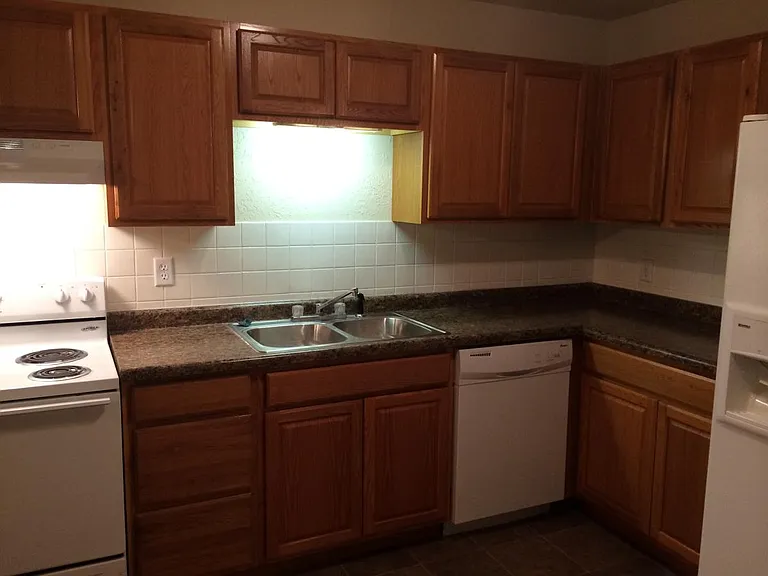 Please note: photos were taken prior to renovation. New luxury vinyl plank flooring, fresh paint throughout, new stainless steel appliances, and a new peninsula countertops are currently being installed.