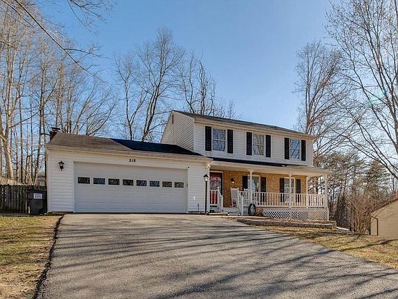 Plenty of parking and a side patio