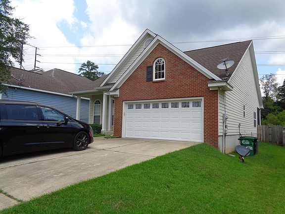 Another view of the front of the home. (Minivan not included. lol)