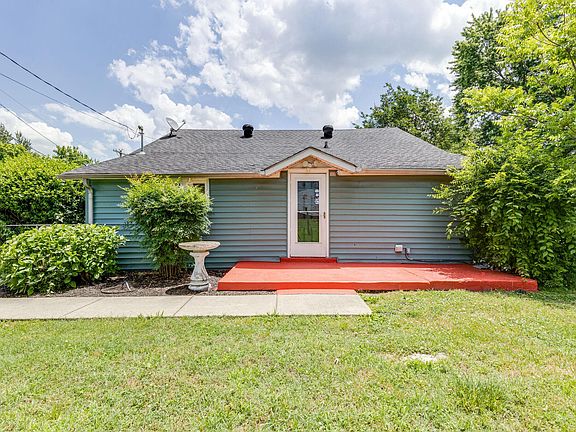 Large back porch and fenced in yard.