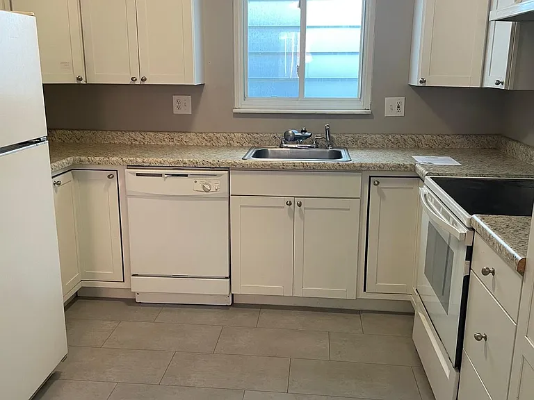 Updated open kitchen, brand new flooring