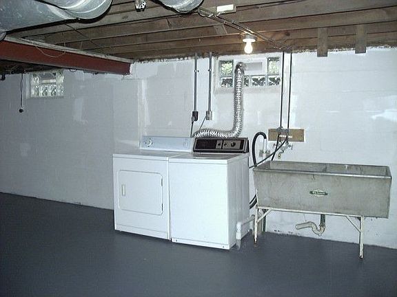 Washer & dryer remain in freshly painted basement