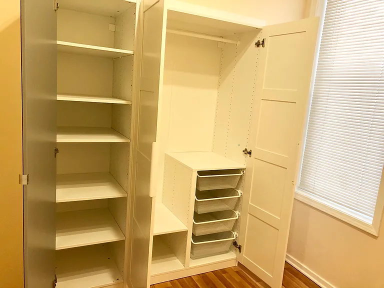 Custom closet with the three doors open.