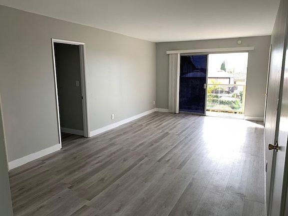 Vies from kitchen/dining area into living room