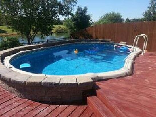 Walled pool has pond view