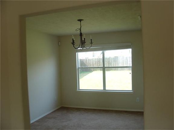 Formal Dining Connects With Den and Kitchen