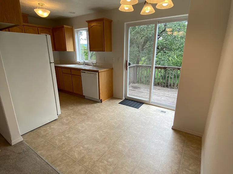Dining area looking into kitchen.